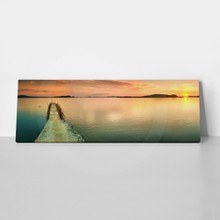Sunset over the sea. pier on the foreground. panorama