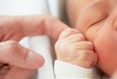 Baby newborn parent finger hand sleep