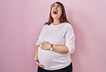 Annoyed pregnant woman