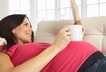 Pregnant woman tea book relaxing