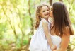 Kiss mother daughter girl happy family