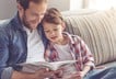 Dad reading book with kid