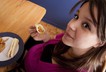 Young pregnant woman eating