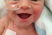 Smiling five days old premature baby girl photo lauren vinje 2